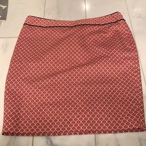 Orange, white, and black pencil skirt.